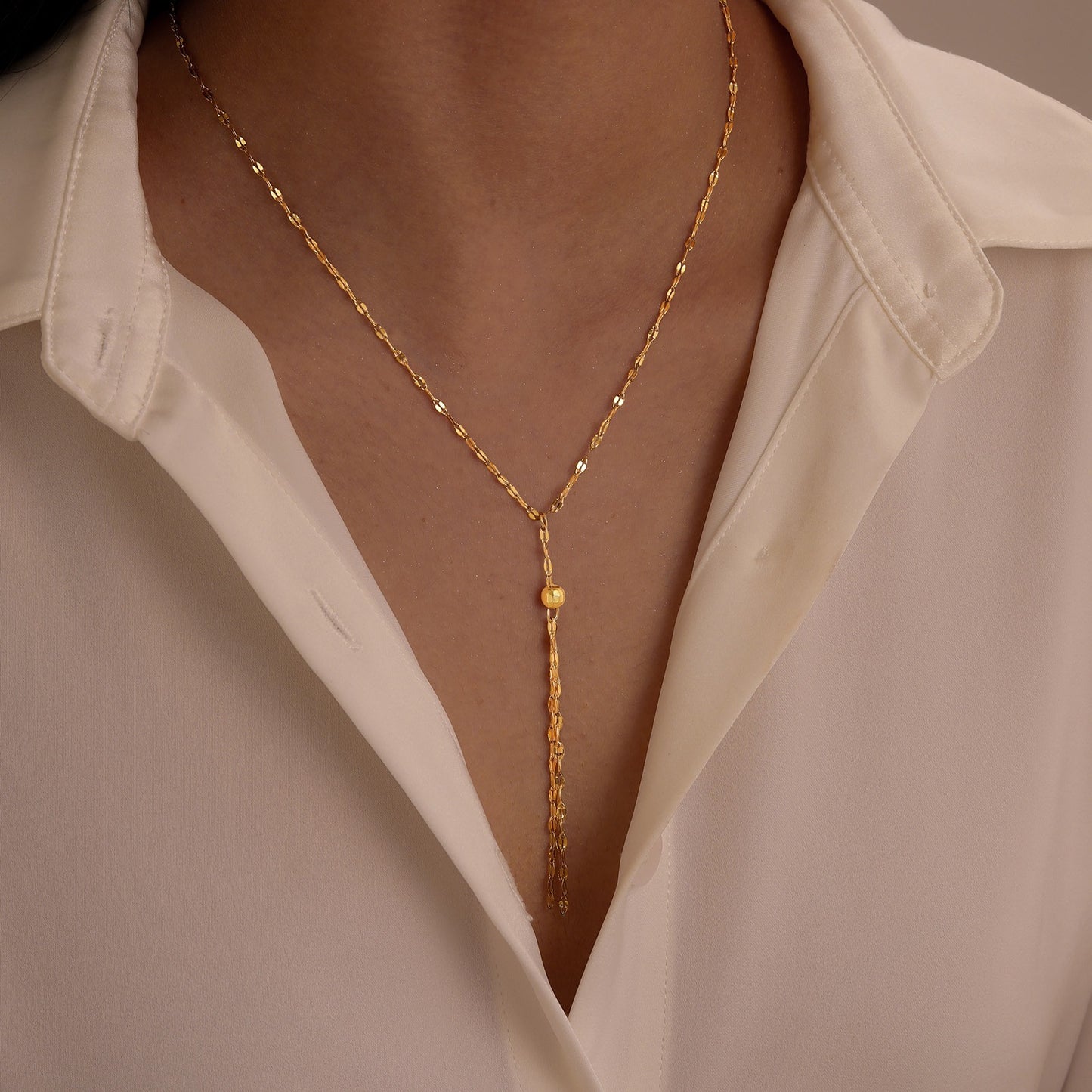 Collar elegante de cadena en Y Kemstone: joyería minimalista de acero inoxidable para mujer en cálido tono dorado NC1836