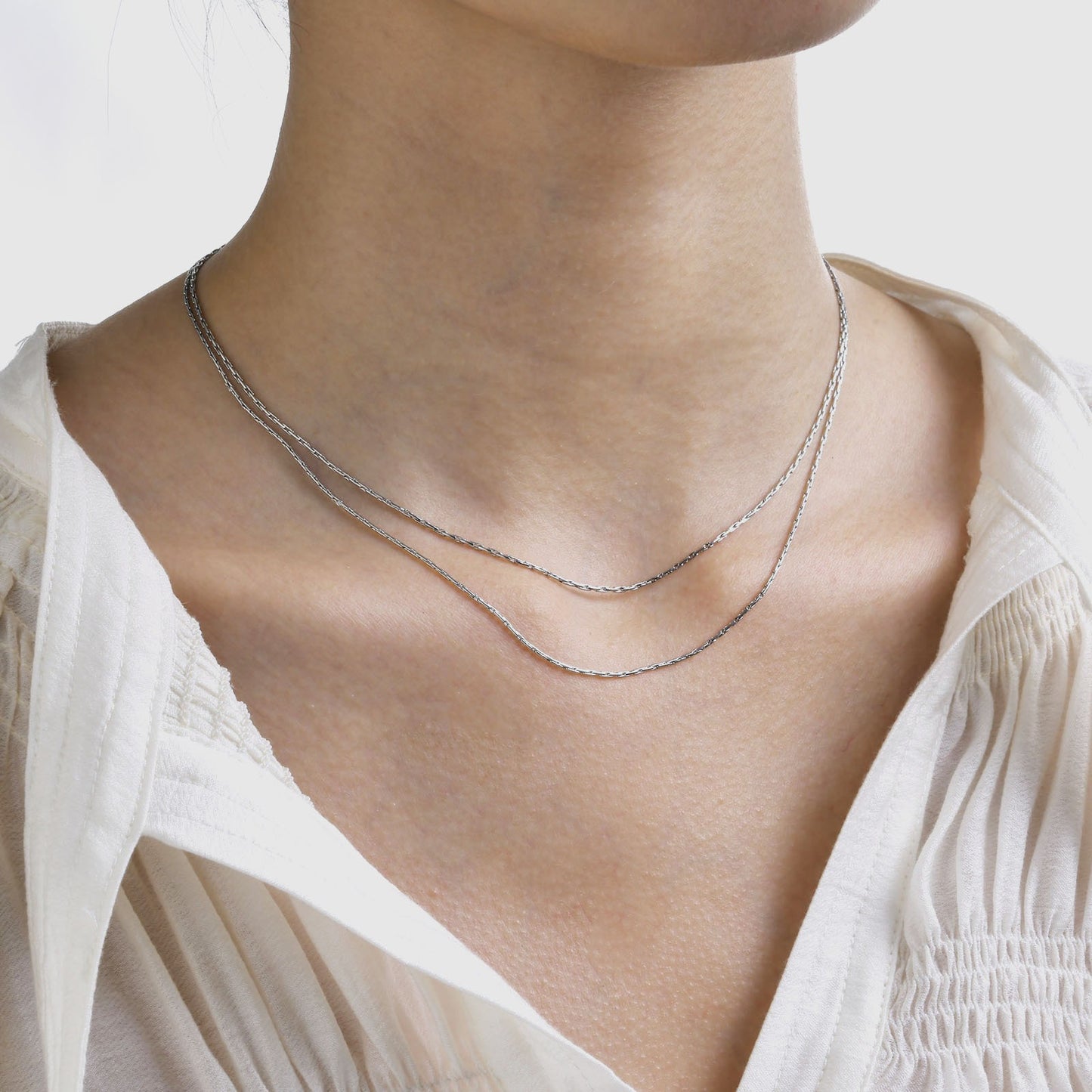 Collar de cadena ovalada de doble capa de acero inoxidable texturizado Kemstone – Joyería ligera dorada para mujer NC-1329