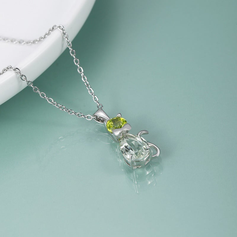 Kemstone – exquisite Halskette mit Katzenanhänger aus natürlichem Edelstein mit Akzenten aus grünem Amethyst und Peridot, 45,7 cm, K23515N