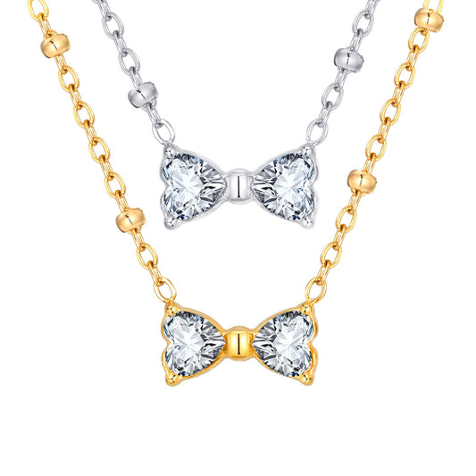 Delicado collar de lazo de acero inoxidable Kemstone con circonitas de cristal y cadena de cuentas. Joyería minimalista en tono dorado para mujer. NC-1718