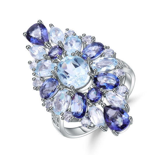 Anillo de plata de ley 925 con topacio natural en forma de flor, elaborado a mano por Kemstone. Diseño original.