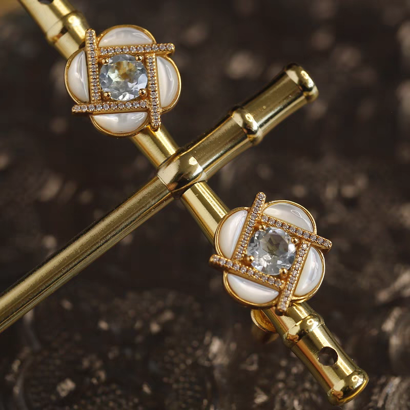 Kemstone Handcrafted Original Design Clover Windmill Earrings – Gold-Plated Silver Mother-of-Pearl Studs with Sky Blue Topaz Accents